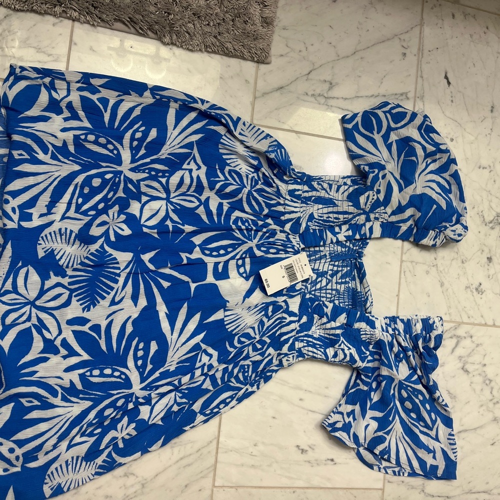 Blue and white dress gauze  material. Elastic bust area low cut back NTW.